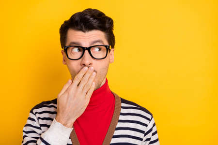 Photo of young man close cover lips hand worried nervous fail mistake look empty space isolated over...