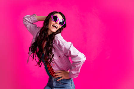 Photo of impressed brunette nice lady look empty space wear spectacles top jacket isolated on pink...