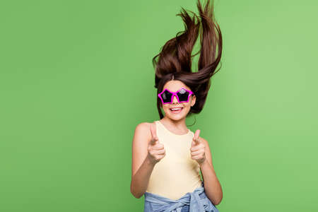 Photo of excited positive person toothy smile direct fingers camera you isolated on green color...
