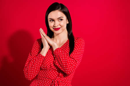 Photo of millennial cool brunette lady look empty space wear red dress isolated on vivid color backgroundの写真素材