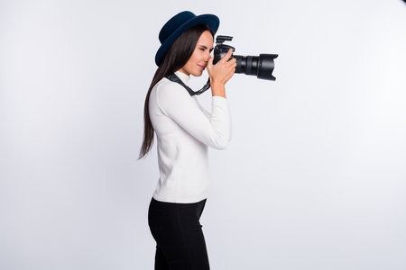 Profile side photo of charming nice young woman occupation journalist shooting isolated on grey...