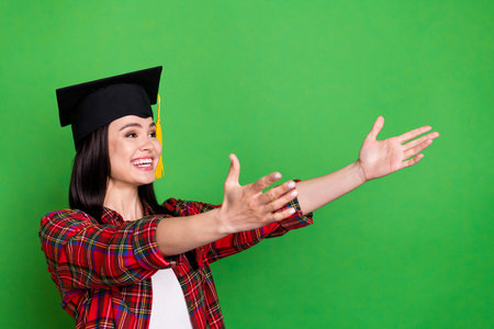 Photo of attractive dreamy nice young woman open hands empty space wear hat isolated on green color...