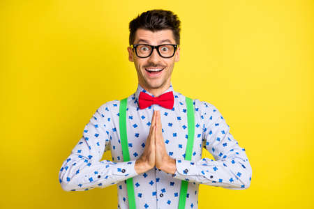 Photo of young excited man happy positive smile excited expect wait dream ask isolated over yellow...