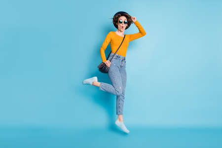 Full size profile photo of optimistic brunette short hairdo lady jump with bag wear shirt jeans...