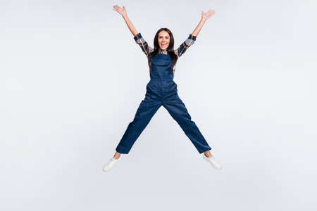 Full size photo of happy good mod excited crazy woman builder constructor jumping isolated on white color backgroundの写真素材