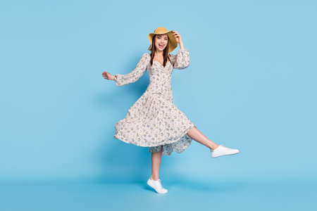 Full size profile photo of fancy brown hairdo young lady dance wear hat dress isolated on blue color backgroundの写真素材