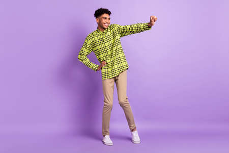 Full length body size view of attractive cheerful guy dancing fooling having fun isolated over...