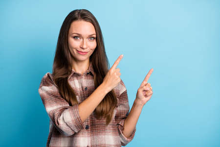 Photo of young happy positive smiling cheerful good looking girl point fingers copyspace isolated on...