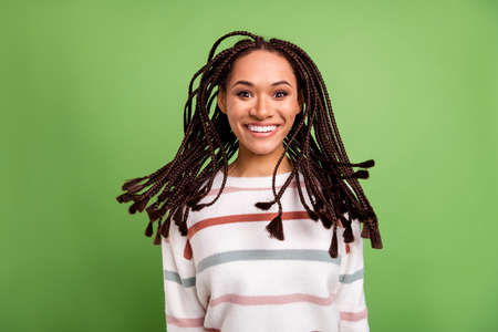 Photo of attractive young african girl happy positive toothy smile isolated over green color...