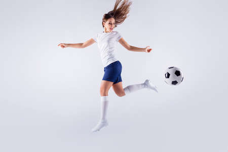 Full length body size view of nice attractive lovely slim sportive glad cheerful cheery straight-haired girl jumping running playing having fun isolated on light white gray pastel color backgroundの写真素材