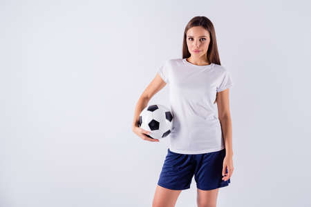 Portrait of her she nice-looking attractive lovely pretty winsome content sportive straight-haired girl holding in hand ball isolated on light white gray pastel color backgroundの写真素材