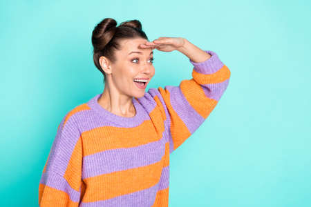 Profile photo of optimistic nice brunette lady hand head look wear sweater isolated on teal color backgroundの写真素材