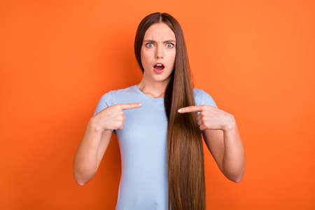 Photo of stressed long hairdo millennial lady point herself wear blue t-shirt isolated on vivid...