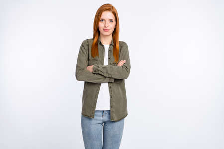 Portrait of attractive cheery content red haired girl folded arms space isolated over white light color backgroundの写真素材