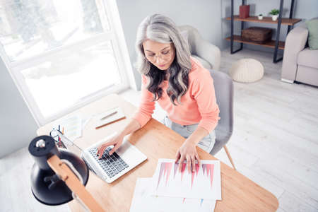 Top above high angle photo of aged business woman paper documents project work desk laptop distance homeの写真素材
