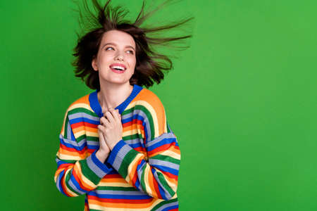 Photo of attractive young nice dreamy woman look empty spade fly wind hair good mood isolated on...