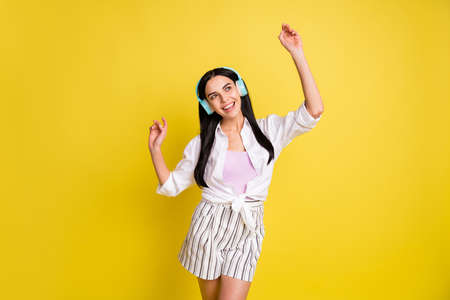 Photo of dreamy pretty happy lady look empty space dance wear headsetの写真素材