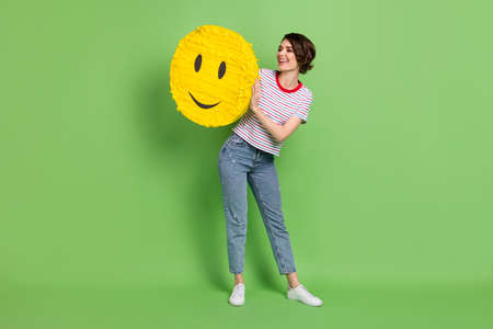 Full length body size view of attractive cheerful glad girl holding in hands big emoji