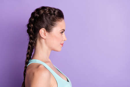 Profile side view portrait of nice attractive content girl copy empty space isolated over violet purple color backgroundの写真素材
