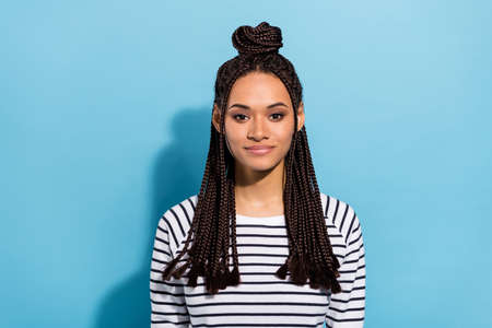 Photo portrait of smiling girl with dreadlocks wearing striped shirt isolated pastel blue color...