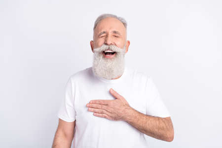 Portrait of attractive dreamy cheerful man laughing lol having fun isolated over white pastel color...