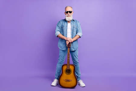Full body photo of aged man happy positive smile guitarist artist star isolated over purple color...