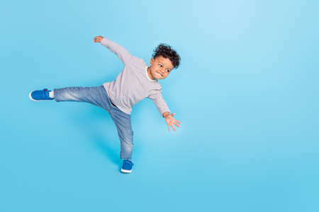 Full length body size view of attractive cheerful sporty boy dancing break having fun isolated over...
