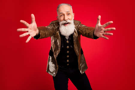 Photo of aged excited man happy positive smile open hands hug cuddle embrace isolated over red color...