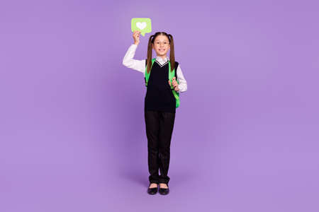 Photo of positive small schoolgirl hold like notification card wear specs uniform isolated violet...