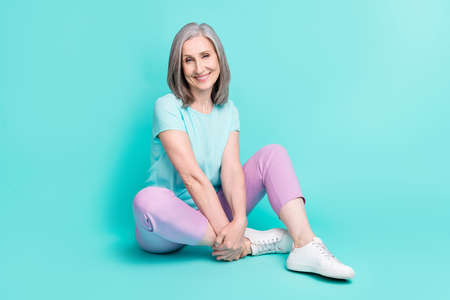 Full size picture of gorgeous cheerful lovely mature woman sit floor enjoying summer weekend...