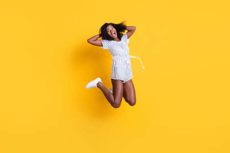 Full length body size view of pretty ecstatic cheerful ecstatic thin girl jumping having fun...