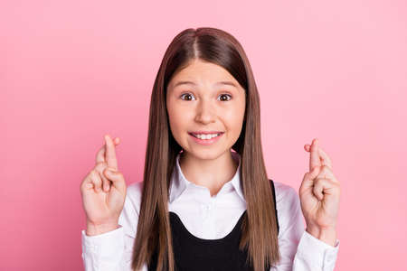 Photo of young school girl happy positive smile crossed hands wish luck exam crossed fingers...