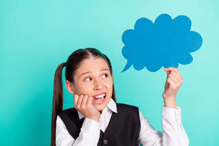 Photo portrait little girl bite fingers stressed keeping cloud with blank space isolated pastel turquoise color backgroundの写真素材