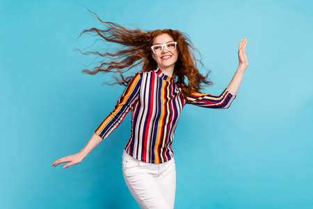 Photo of funky red hairdo lady dance look empty space wear spectacles colorful shirt isolated on...