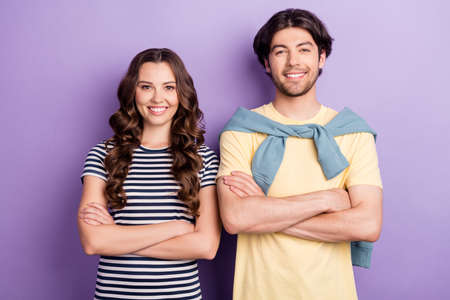 Photo of sweet charming lovers dressed casual outfit arms crossed smiling isolated purple color...