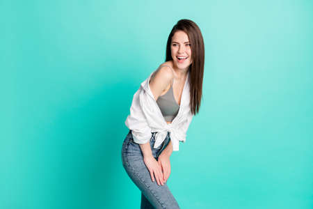 Photo of dreamy young woman look empty space dream imagine weekend isolated on pastel teal color backgroundの写真素材