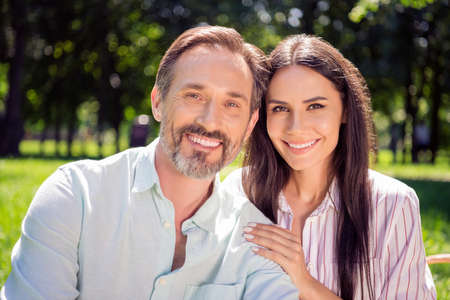 Portrait of two attractive affectionate cheerful people soulmates enjoying good weather picnic...