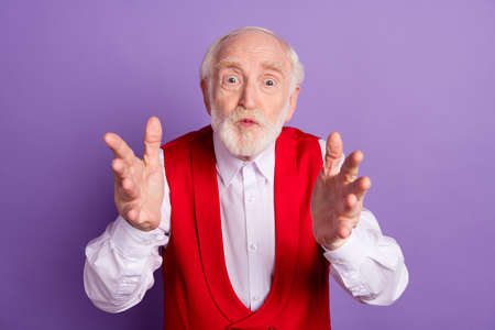 Photo of handsome aged man pouted lips send air kiss open arms hug isolated over violet color backgroundの写真素材