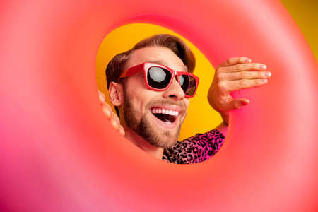 Photo of funny pretty young gentleman dressed print shirt dark glasses looking head swim circle...