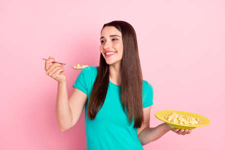 Profile side photo of young woman happy positive smile eat meal yummy tasty food cornflakes crisp...