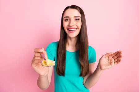 Photo of young cheerful woman happy positive smile feed meal lunch spoon cornflakes tasty isolated...