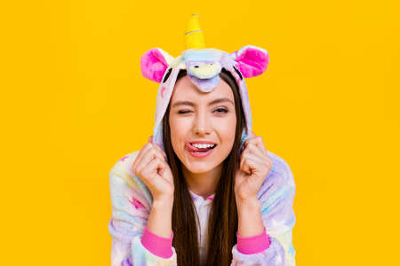 Portrait of attractive cheerful girl wearing animal clothes grimacing having fun isolated over...