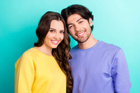 Photo of young attractive couple happy positive smile embrace lovers isolated over teal color...