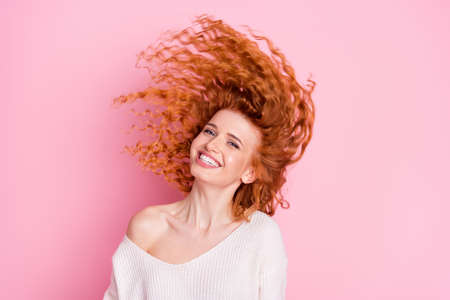 Photo portrait of young girl smiling hair flying in air wearing white sweater with off-shoulder...