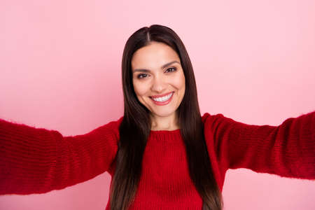 Photo of sweet brunette lady do selfie wear red pullover isolated on pink color background