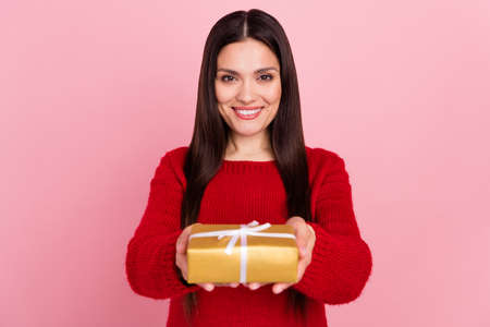 Photo of nice brunette lady hold present give you wear red pullover isolated on pink color...