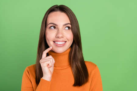 Photo portrait woman smiling looking copyspace touching chin idea isolated pastel green color...