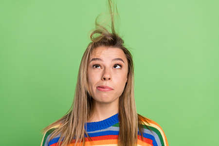 Photo portrait girl grimacing fooling blowing hair isolated pastel green color backgroundの写真素材