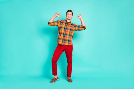 Full body photo of nice brunet millennial guy point himself wear shirt trousers sneakers isolated on teal backgroundの写真素材