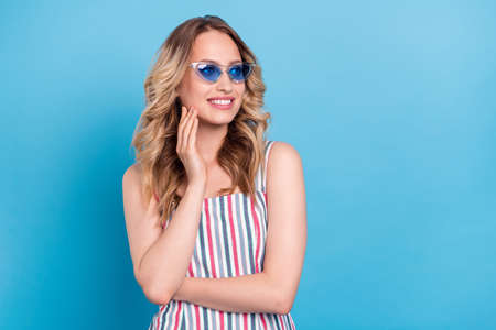 Photo portrait blonde woman in sunglass folded hands looking copyspace isolated pastel blue color...
